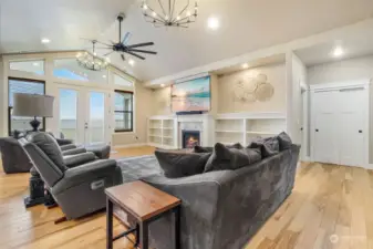 Propane fireplace flanked by built in bookcases.