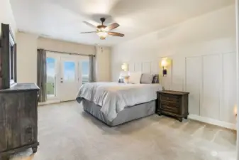 Huge primary bedroom with access to the hot tub through the patio door.