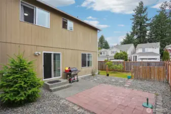 Backyard is ready for BBQ, summer fun, pets, and play.