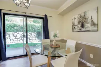 Slider leads out to private patio and green space.