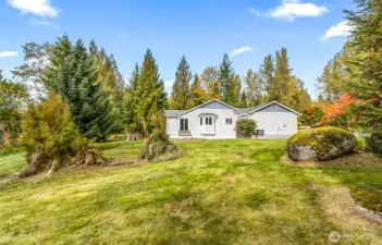 View from the side of the home, established landscaping