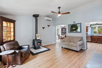 Wood stove that provides lots of warmth and a whole stack of firewood ready for winter!