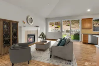 Cozy fireplace and lots of room to spread out in the Great Room. Virtually staged.