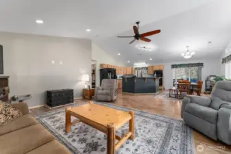 Living room, dining room and kitchen are all open to each other. Vaulted ceilings give a spacious feel.