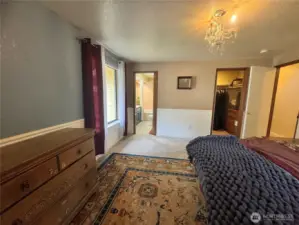 The primary bedroom with its own private walk-in closet and double vanity bathroom.