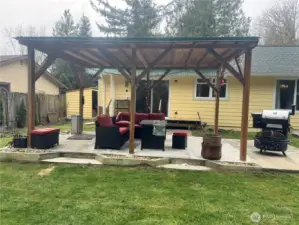 This large covered patio is perfect for outdoor activities, even when it's raining. Barbequing, sitting around the firepit and playing outdoor games. There's also an uncovered area that's perfect for catching the rays on our many sunny days.