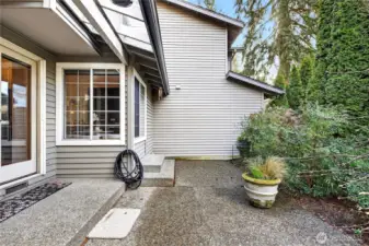 Part of backyard patio just off the kitchen nook, offering easy indoor-outdoor flow. Ideal for morning coffee or casual dining, surrounded by greenery & a relaxing, tranquil setting.