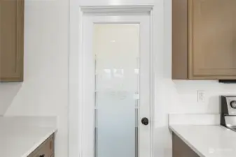 Door to your oversized walk-in pantry.