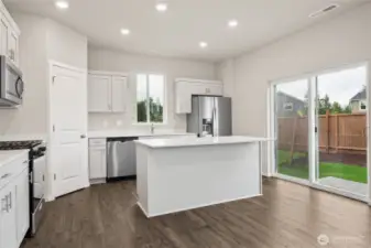 Kitchen. Photos of previously built home of same floorplan. Colors, Specifications, and Options may vary on actual home.