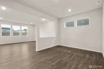 Dining Room and Living Room. Photos of previously built home of same floorplan. Colors, Specifications, and Options may vary on actual home.