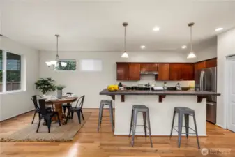 sprawling kitchen/dining area flows seamlessly out to the back patio and into the large living room!