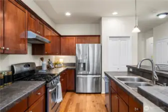 sprawling kitchen/dining area flows seamlessly out to the back patio and into the large living room!
