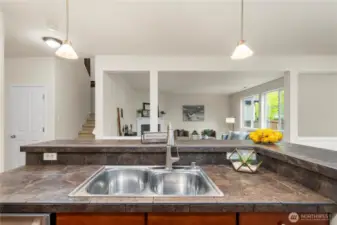 sprawling kitchen/dining area flows seamlessly out to the back patio and into the large living room!