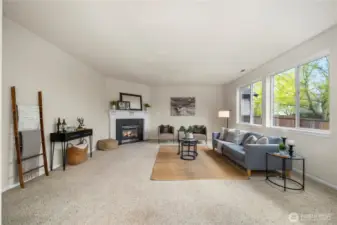 The living room is massive and is open to the large kitchen + dining room