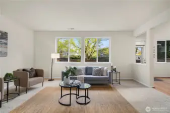 The living room is massive and is open to the large kitchen + dining room