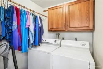 Laundy room with full size washer and dryer that stay.