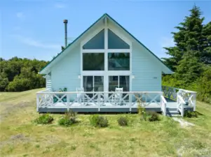 Front of home with wrap around deck