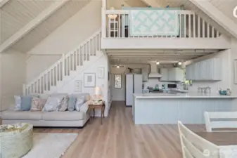 View to kitchen & stairs up to 2nd level with sleeping nook/upper level primary suite