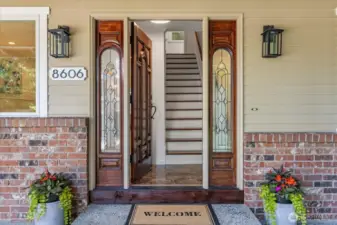 Freshly restained front door with side lights welcome you into this traditional 2 story home.