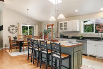 You will love this kitchen with a large island featuring butcher block countertops and a separate washing station.