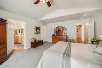 The far door to the right is your walk-in closet, to the left is your spacious 5-piece primary bath!