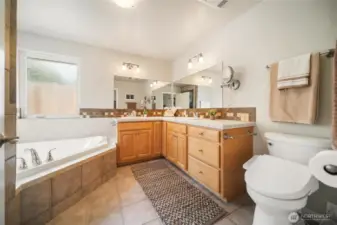 The generous 5-piece primary bathroom is truly lovely and adds a touch of luxury.