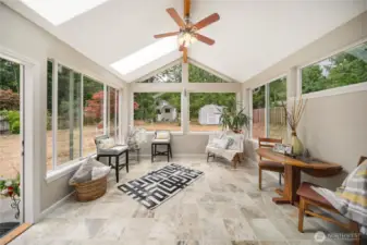 The 2013 addition of a stunning sunroom with heated tile floors offers the perfect space for year-round relaxation and enjoyment.