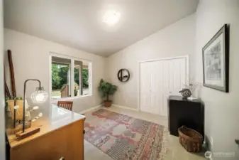 Large window overlooks front patio.