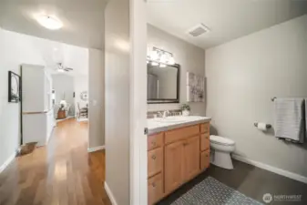 A full bathroom conveniently accessible for guests and dedicated to the second bedroom.