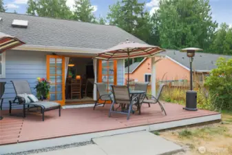 The expansive outdoor living space seamlessly connects the indoors to the outdoors—creating a welcoming flow, or is it the outdoors coming inside?