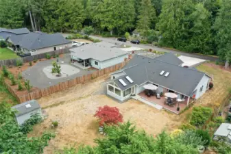 The backyard features a spacious shed for all your storage needs and room for a garden—what creative ideas will you bring to this versatile space?