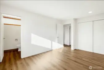 Primary bedroom with half bath.