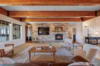 The windows on the left bring in abundant light from a lovely four season sunroom