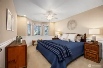 The main floor guest bedroom is privately located away on the opposite side of the house