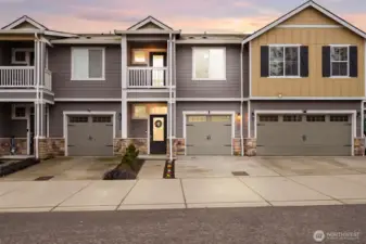 Move-in ready and well maintained townhome exterior with attached garage and newly pressured wash driveway.