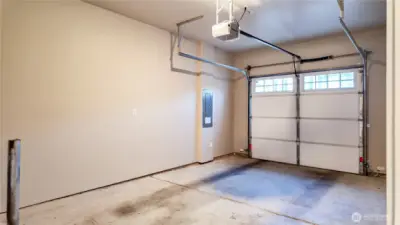 Attached garage with automatic opener.