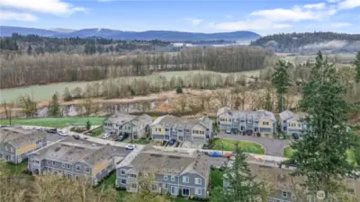 Aerial view capturing open space, trees, and peaceful surroundings.