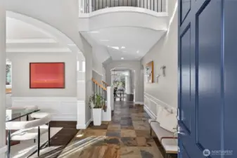 Soaring two-story entry with a glimpse of all the magnificent architectural details throughout the home.