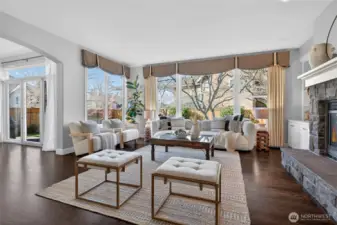 Gracious family room off the kitchen with gas fireplace and huge windows!