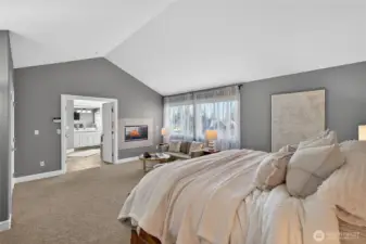 Dual-sided fireplace makes a statement in the primary suite.