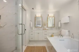 Tile surround shower. Water closet with Toto Washlet commode.