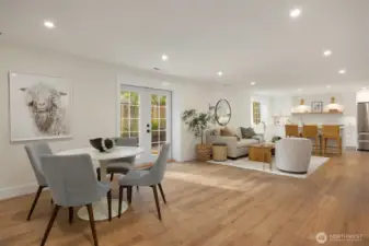 The 1700+sf lower level living space with heating/cooling + heated floors;  kitchen, 3/4 bath, a bedroom, sauna room and media room + a private entrance option.