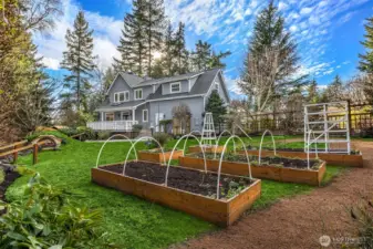 Raised beds, fruit trees, fire pit, garden paths