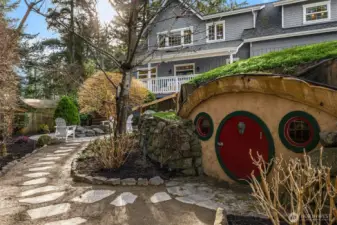 The signature Hobbit House. Parklike grounds with meandering trails, a grove of evergreens, a lawn... magical.