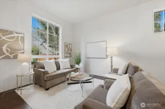 Living room in the front of the house with extra tall ceilings