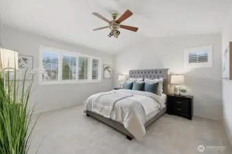 Primary bedroom overlooking the backyard