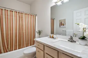 The 2nd full bath in the home is located off the hallway and adjacent to the 2nd bedroom.