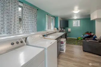 Surprisingly spacious 264' laundry room with utility sink, radiant wall heat, and plenty of extra space.