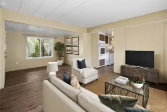 Large open living room with LP flooring for easy care. Room has been virtually staged