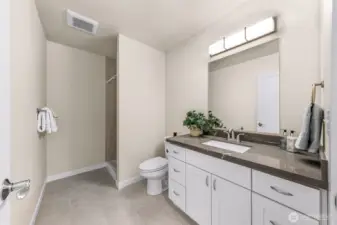 Second bedroom bathroom with walk in shower.